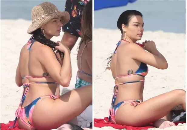 Isis Valverde curte praia no dia mais quente do inverno no Rio